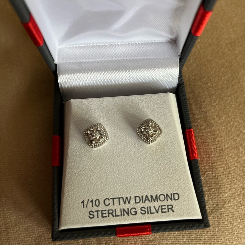 1/10 CCTW diamond sterling silver stud earrings.